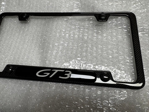 Porsche GT3 carbon fiber plate frame with a raised center section.